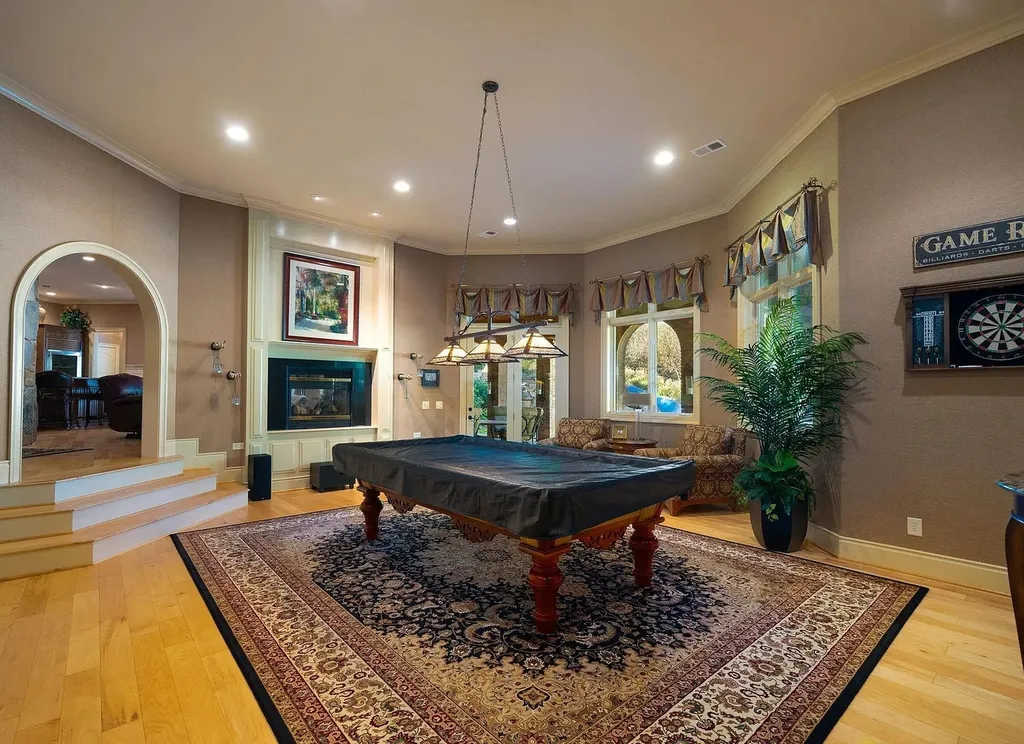 2421 Acanthus Drive Home in Wake Forest, North Carolina. Step into the world of luxury with this exceptional gated estate located in the Back Nine, featured in the Parade of Homes. Spanning 14,438 sqft, this masterfully crafted home boasts 6 bedrooms, 9 bathrooms, and lavish finishes throughout. Enjoy the grand foyer, two kitchens, theater room, wine cellar, and exercise room.