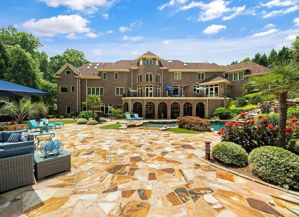 2421 Acanthus Drive Home in Wake Forest, North Carolina. Step into the world of luxury with this exceptional gated estate located in the Back Nine, featured in the Parade of Homes. Spanning 14,438 sqft, this masterfully crafted home boasts 6 bedrooms, 9 bathrooms, and lavish finishes throughout. Enjoy the grand foyer, two kitchens, theater room, wine cellar, and exercise room.