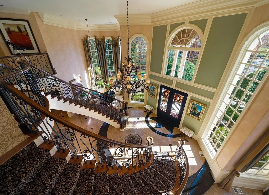 2421 Acanthus Drive Home in Wake Forest, North Carolina. Step into the world of luxury with this exceptional gated estate located in the Back Nine, featured in the Parade of Homes. Spanning 14,438 sqft, this masterfully crafted home boasts 6 bedrooms, 9 bathrooms, and lavish finishes throughout. Enjoy the grand foyer, two kitchens, theater room, wine cellar, and exercise room.