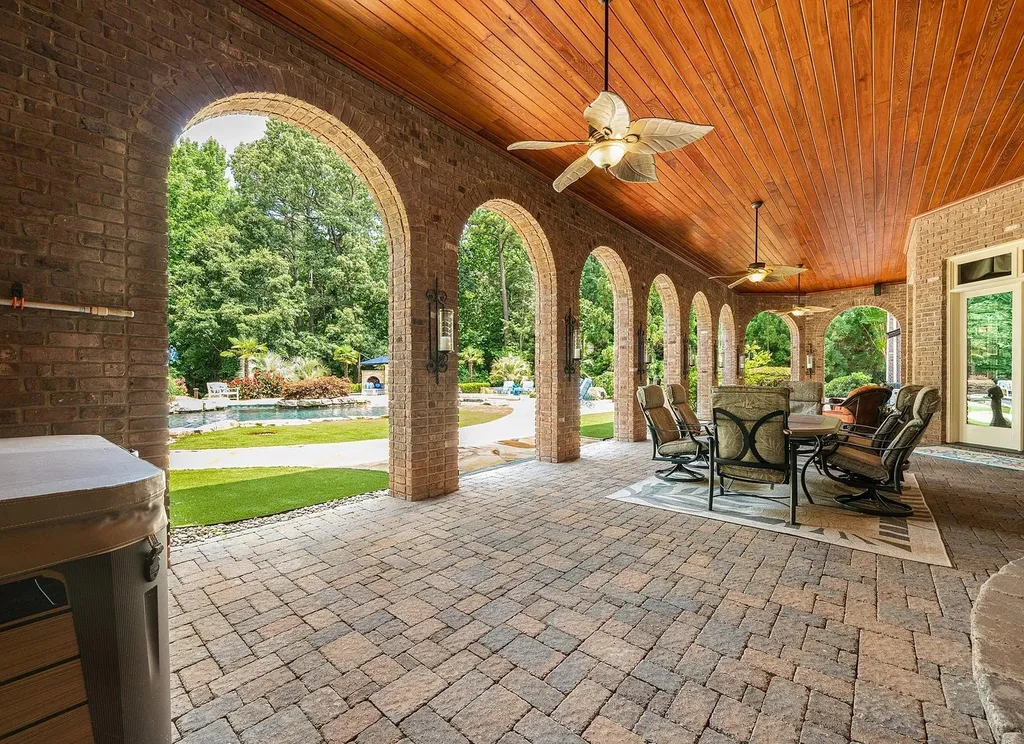 2421 Acanthus Drive Home in Wake Forest, North Carolina. Step into the world of luxury with this exceptional gated estate located in the Back Nine, featured in the Parade of Homes. Spanning 14,438 sqft, this masterfully crafted home boasts 6 bedrooms, 9 bathrooms, and lavish finishes throughout. Enjoy the grand foyer, two kitchens, theater room, wine cellar, and exercise room.