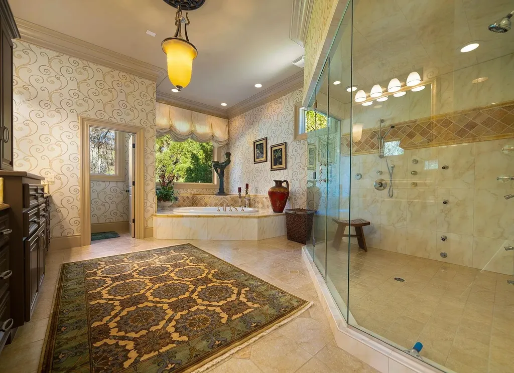 2421 Acanthus Drive Home in Wake Forest, North Carolina. Step into the world of luxury with this exceptional gated estate located in the Back Nine, featured in the Parade of Homes. Spanning 14,438 sqft, this masterfully crafted home boasts 6 bedrooms, 9 bathrooms, and lavish finishes throughout. Enjoy the grand foyer, two kitchens, theater room, wine cellar, and exercise room.