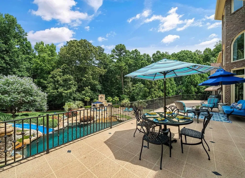 2421 Acanthus Drive Home in Wake Forest, North Carolina. Step into the world of luxury with this exceptional gated estate located in the Back Nine, featured in the Parade of Homes. Spanning 14,438 sqft, this masterfully crafted home boasts 6 bedrooms, 9 bathrooms, and lavish finishes throughout. Enjoy the grand foyer, two kitchens, theater room, wine cellar, and exercise room.