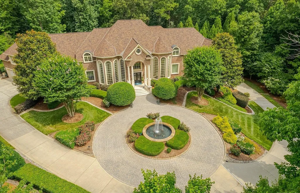 2421 Acanthus Drive Home in Wake Forest, North Carolina. Step into the world of luxury with this exceptional gated estate located in the Back Nine, featured in the Parade of Homes. Spanning 14,438 sqft, this masterfully crafted home boasts 6 bedrooms, 9 bathrooms, and lavish finishes throughout. Enjoy the grand foyer, two kitchens, theater room, wine cellar, and exercise room.