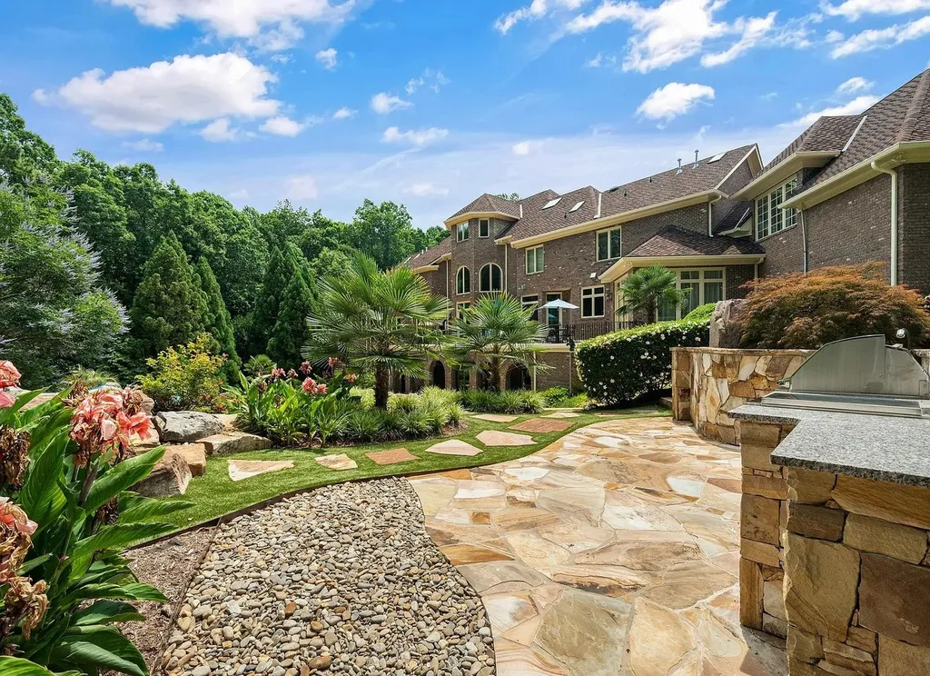 2421 Acanthus Drive Home in Wake Forest, North Carolina. Step into the world of luxury with this exceptional gated estate located in the Back Nine, featured in the Parade of Homes. Spanning 14,438 sqft, this masterfully crafted home boasts 6 bedrooms, 9 bathrooms, and lavish finishes throughout. Enjoy the grand foyer, two kitchens, theater room, wine cellar, and exercise room.