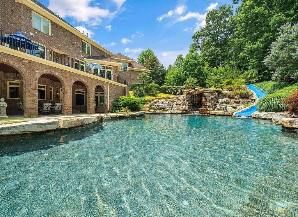 2421 Acanthus Drive Home in Wake Forest, North Carolina. Step into the world of luxury with this exceptional gated estate located in the Back Nine, featured in the Parade of Homes. Spanning 14,438 sqft, this masterfully crafted home boasts 6 bedrooms, 9 bathrooms, and lavish finishes throughout. Enjoy the grand foyer, two kitchens, theater room, wine cellar, and exercise room.