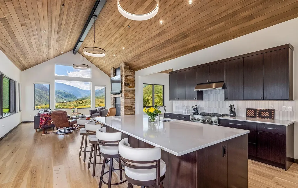 2445 Frost Creek Drive Home in Eagle, Colorado. Discover the epitome of elegant mountain living in this custom-designed Frost Creek home. Perched on the highest point, this exquisite residence offers 360-degree views of the private Club of Frost Creek and Brush Creek Valley.