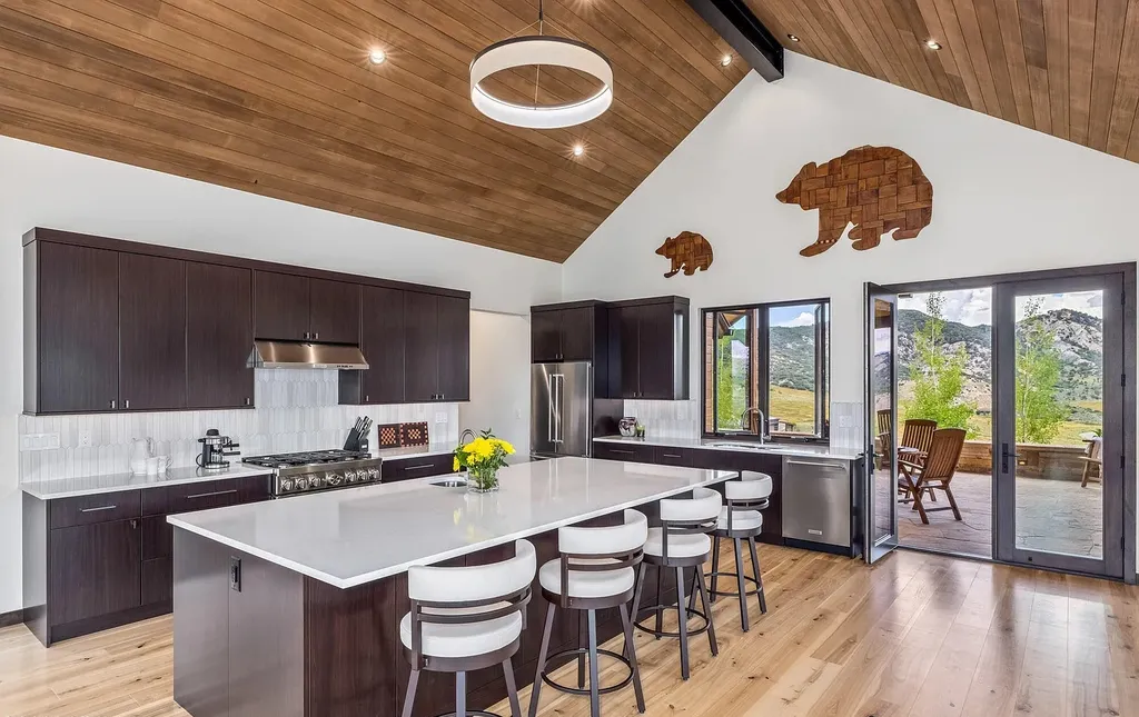 2445 Frost Creek Drive Home in Eagle, Colorado. Discover the epitome of elegant mountain living in this custom-designed Frost Creek home. Perched on the highest point, this exquisite residence offers 360-degree views of the private Club of Frost Creek and Brush Creek Valley.