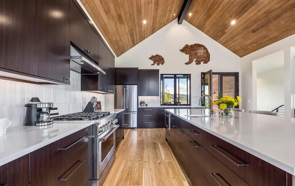 2445 Frost Creek Drive Home in Eagle, Colorado. Discover the epitome of elegant mountain living in this custom-designed Frost Creek home. Perched on the highest point, this exquisite residence offers 360-degree views of the private Club of Frost Creek and Brush Creek Valley.