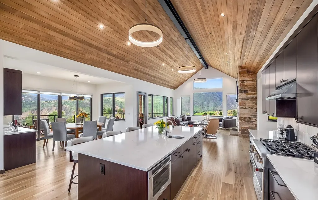 2445 Frost Creek Drive Home in Eagle, Colorado. Discover the epitome of elegant mountain living in this custom-designed Frost Creek home. Perched on the highest point, this exquisite residence offers 360-degree views of the private Club of Frost Creek and Brush Creek Valley.