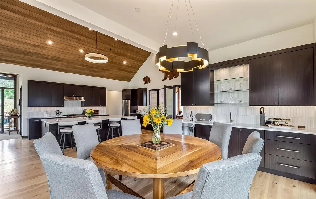 2445 Frost Creek Drive Home in Eagle, Colorado. Discover the epitome of elegant mountain living in this custom-designed Frost Creek home. Perched on the highest point, this exquisite residence offers 360-degree views of the private Club of Frost Creek and Brush Creek Valley.
