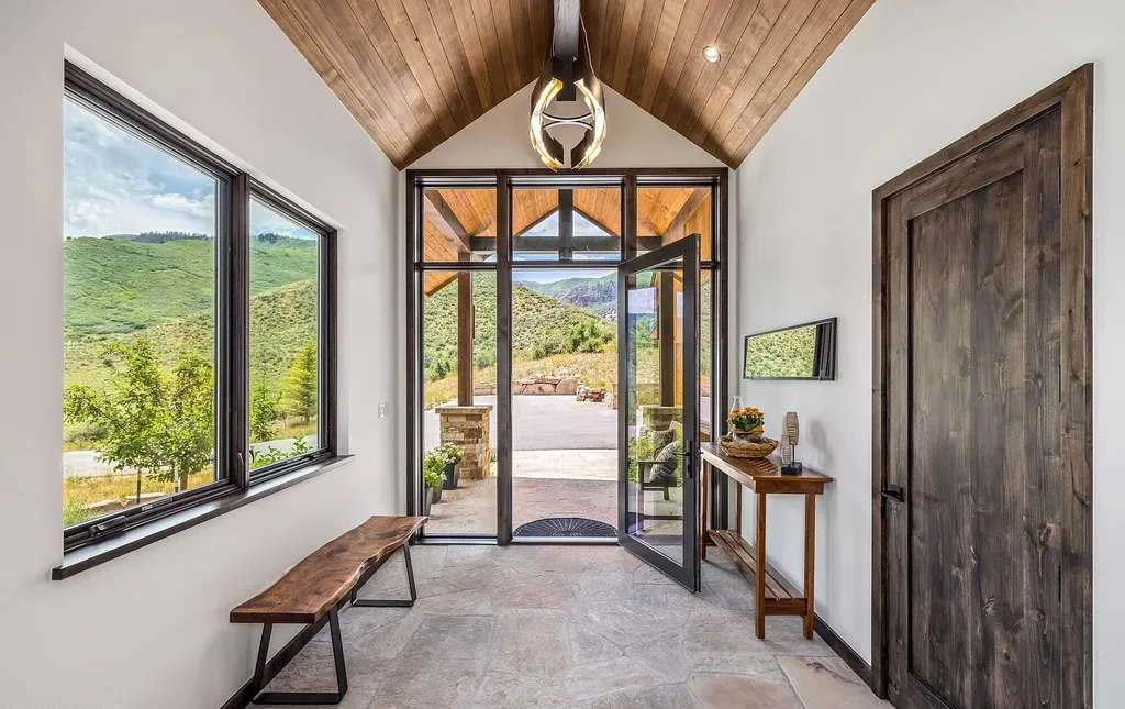 2445 Frost Creek Drive Home in Eagle, Colorado. Discover the epitome of elegant mountain living in this custom-designed Frost Creek home. Perched on the highest point, this exquisite residence offers 360-degree views of the private Club of Frost Creek and Brush Creek Valley.