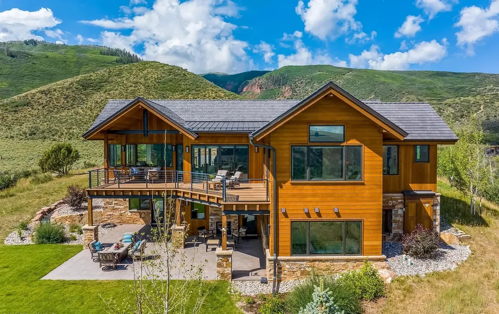 2445 Frost Creek Drive Home in Eagle, Colorado. Discover the epitome of elegant mountain living in this custom-designed Frost Creek home. Perched on the highest point, this exquisite residence offers 360-degree views of the private Club of Frost Creek and Brush Creek Valley.