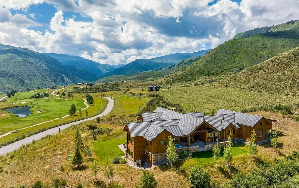 2445 Frost Creek Drive Home in Eagle, Colorado. Discover the epitome of elegant mountain living in this custom-designed Frost Creek home. Perched on the highest point, this exquisite residence offers 360-degree views of the private Club of Frost Creek and Brush Creek Valley.