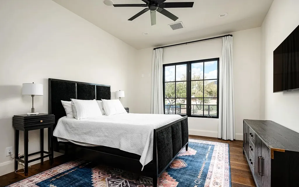 24546 North 91st Street Home in Scottsdale, Arizona. Discover the epitome of modern luxury at this renovated Modern Spanish estate in Prado Estates. Crafted by Mike Graham of American First Builders, the property showcases sweeping mountain and city views across its rare 4.7-acre lot.