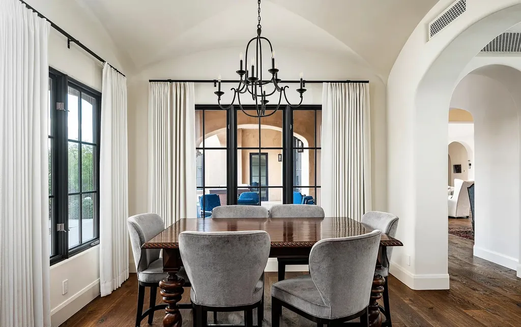 24546 North 91st Street Home in Scottsdale, Arizona. Discover the epitome of modern luxury at this renovated Modern Spanish estate in Prado Estates. Crafted by Mike Graham of American First Builders, the property showcases sweeping mountain and city views across its rare 4.7-acre lot.