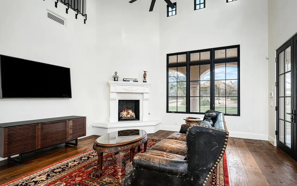 24546 North 91st Street Home in Scottsdale, Arizona. Discover the epitome of modern luxury at this renovated Modern Spanish estate in Prado Estates. Crafted by Mike Graham of American First Builders, the property showcases sweeping mountain and city views across its rare 4.7-acre lot.