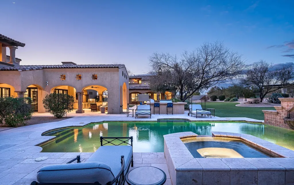 24546 North 91st Street Home in Scottsdale, Arizona. Discover the epitome of modern luxury at this renovated Modern Spanish estate in Prado Estates. Crafted by Mike Graham of American First Builders, the property showcases sweeping mountain and city views across its rare 4.7-acre lot.