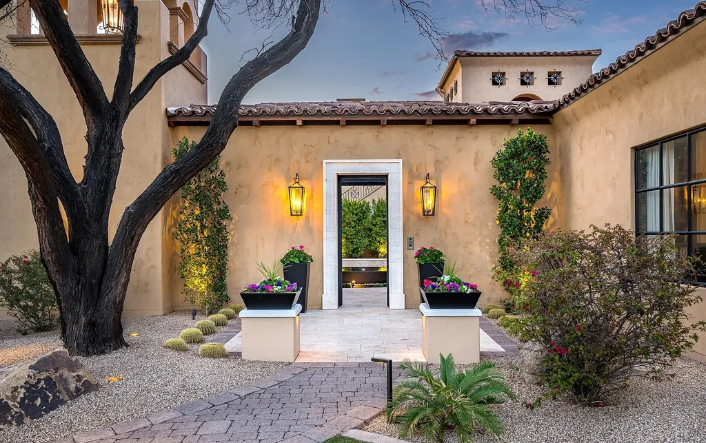 24546 North 91st Street Home in Scottsdale, Arizona. Discover the epitome of modern luxury at this renovated Modern Spanish estate in Prado Estates. Crafted by Mike Graham of American First Builders, the property showcases sweeping mountain and city views across its rare 4.7-acre lot.