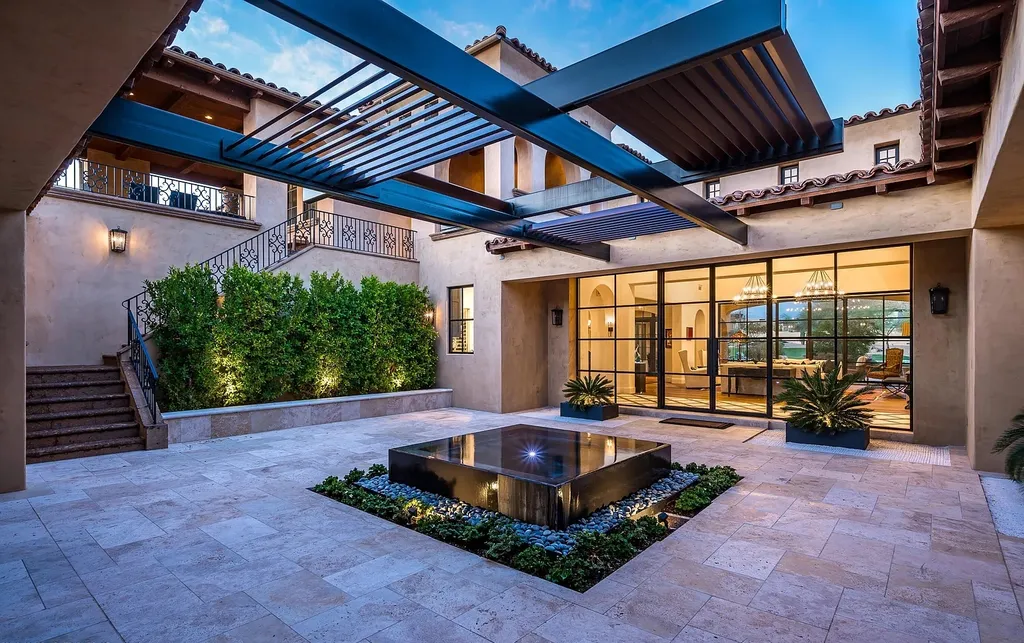 24546 North 91st Street Home in Scottsdale, Arizona. Discover the epitome of modern luxury at this renovated Modern Spanish estate in Prado Estates. Crafted by Mike Graham of American First Builders, the property showcases sweeping mountain and city views across its rare 4.7-acre lot.