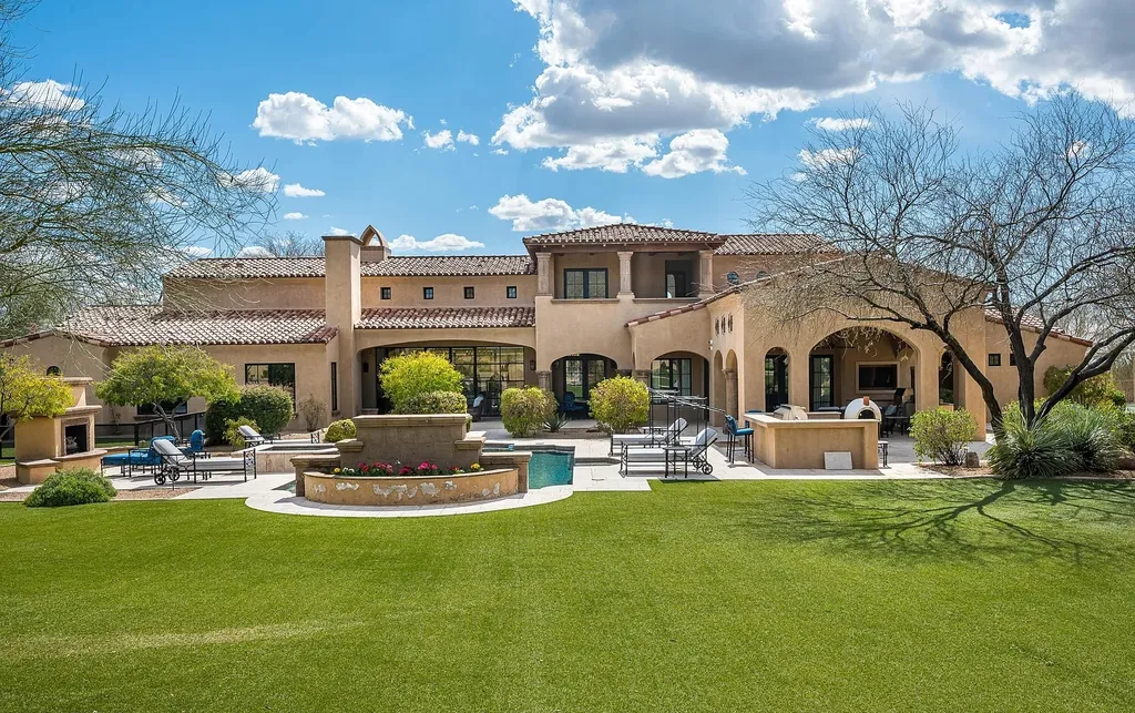 24546 North 91st Street Home in Scottsdale, Arizona. Discover the epitome of modern luxury at this renovated Modern Spanish estate in Prado Estates. Crafted by Mike Graham of American First Builders, the property showcases sweeping mountain and city views across its rare 4.7-acre lot.