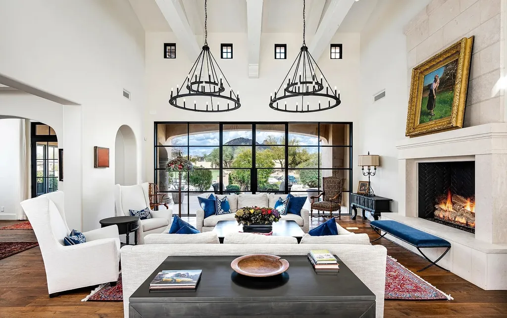 24546 North 91st Street Home in Scottsdale, Arizona. Discover the epitome of modern luxury at this renovated Modern Spanish estate in Prado Estates. Crafted by Mike Graham of American First Builders, the property showcases sweeping mountain and city views across its rare 4.7-acre lot.