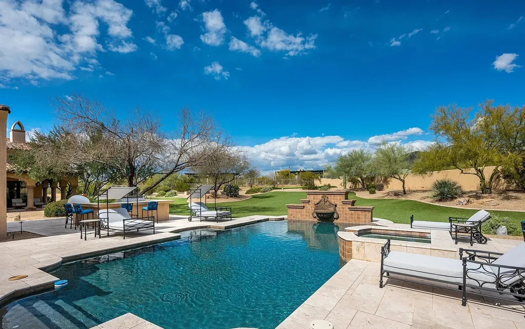 24546 North 91st Street Home in Scottsdale, Arizona. Discover the epitome of modern luxury at this renovated Modern Spanish estate in Prado Estates. Crafted by Mike Graham of American First Builders, the property showcases sweeping mountain and city views across its rare 4.7-acre lot.
