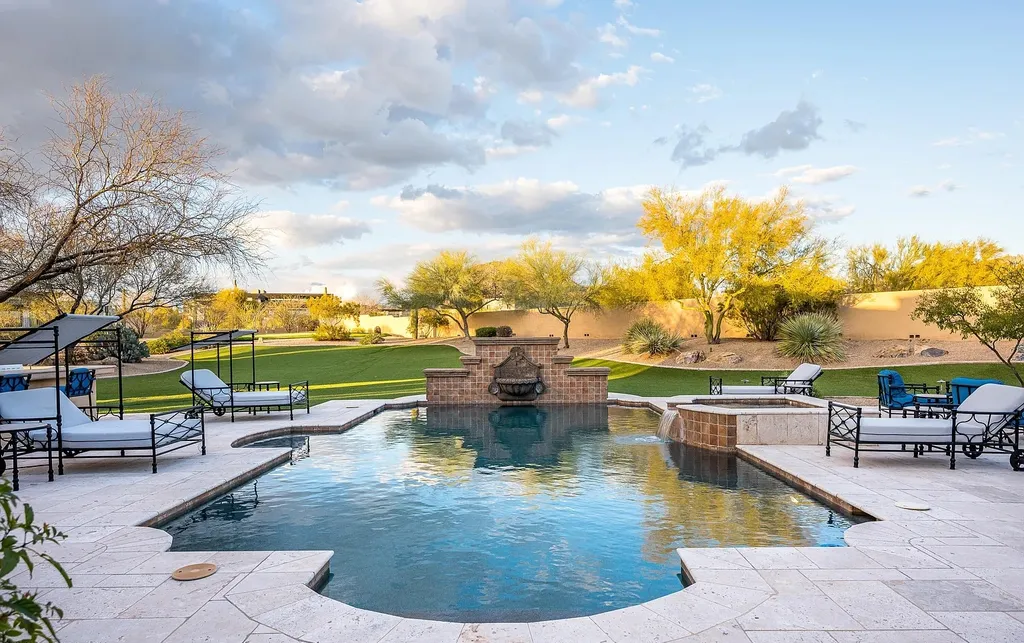 24546 North 91st Street Home in Scottsdale, Arizona. Discover the epitome of modern luxury at this renovated Modern Spanish estate in Prado Estates. Crafted by Mike Graham of American First Builders, the property showcases sweeping mountain and city views across its rare 4.7-acre lot.