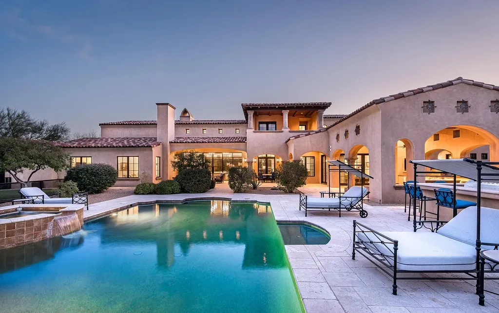 24546 North 91st Street Home in Scottsdale, Arizona. Discover the epitome of modern luxury at this renovated Modern Spanish estate in Prado Estates. Crafted by Mike Graham of American First Builders, the property showcases sweeping mountain and city views across its rare 4.7-acre lot.