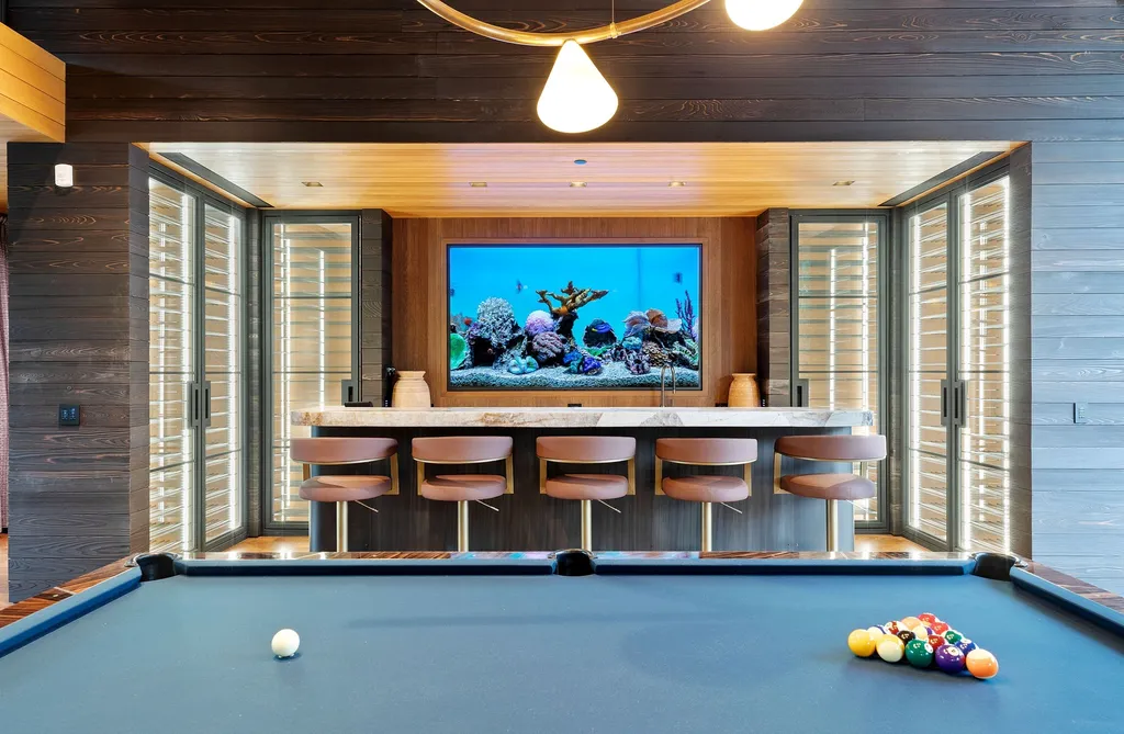 253 White Pine Canyon Road Home in Park City, Utah. Explore the unparalleled luxury of ''Monitor's Rest'', winner of the prestigious Robb Report Best of the Best award for 'Best Amenities'. Situated in the exclusive enclave of The Colony at White Pine Canyon, this ski-in/ski-out mountain masterpiece offers 5 acres of modern luxury. 
