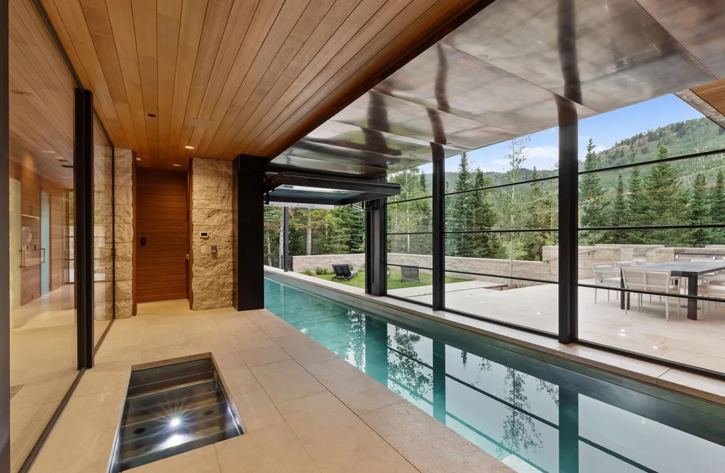 253 White Pine Canyon Road Home in Park City, Utah. Explore the unparalleled luxury of ''Monitor's Rest'', winner of the prestigious Robb Report Best of the Best award for 'Best Amenities'. Situated in the exclusive enclave of The Colony at White Pine Canyon, this ski-in/ski-out mountain masterpiece offers 5 acres of modern luxury. 