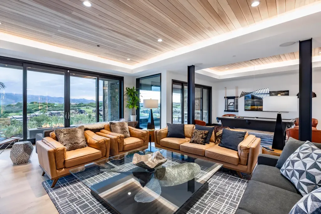 2645 E Shadow Ridge Circle Home in Heber, Utah. Experience the epitome of luxury living in the heart of Tuhaye with this stunning new build that awaits your immediate move-in. This extraordinary residence boasts a meticulously crafted and expansive floor plan, showcasing over 1,500 sqft of deck and patio spaces that invite you to savor the surrounding beauty