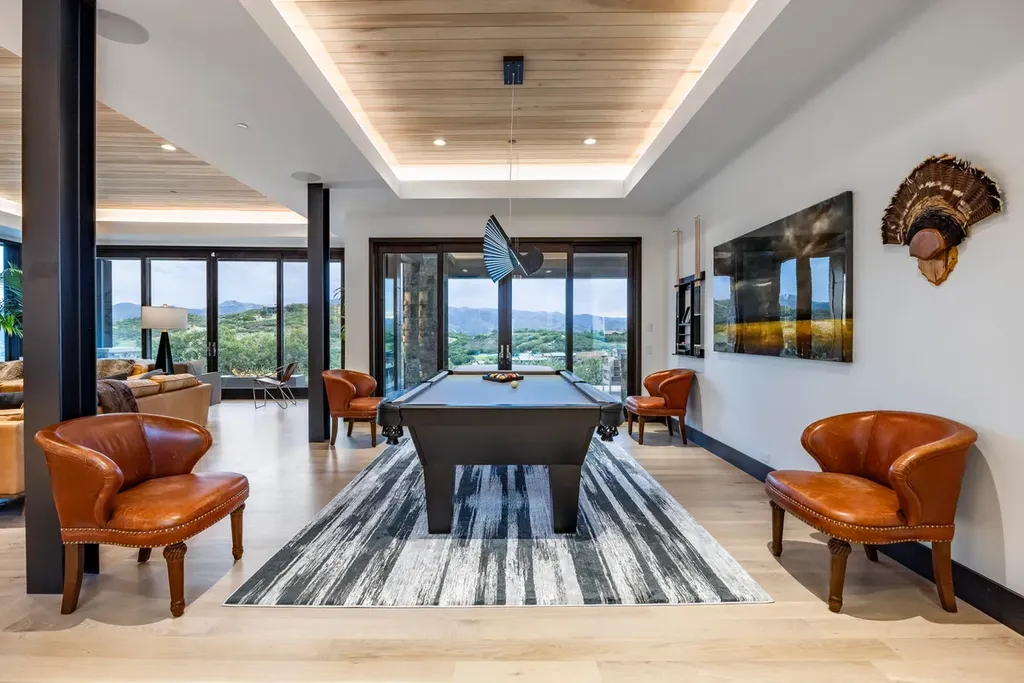 2645 E Shadow Ridge Circle Home in Heber, Utah. Experience the epitome of luxury living in the heart of Tuhaye with this stunning new build that awaits your immediate move-in. This extraordinary residence boasts a meticulously crafted and expansive floor plan, showcasing over 1,500 sqft of deck and patio spaces that invite you to savor the surrounding beauty