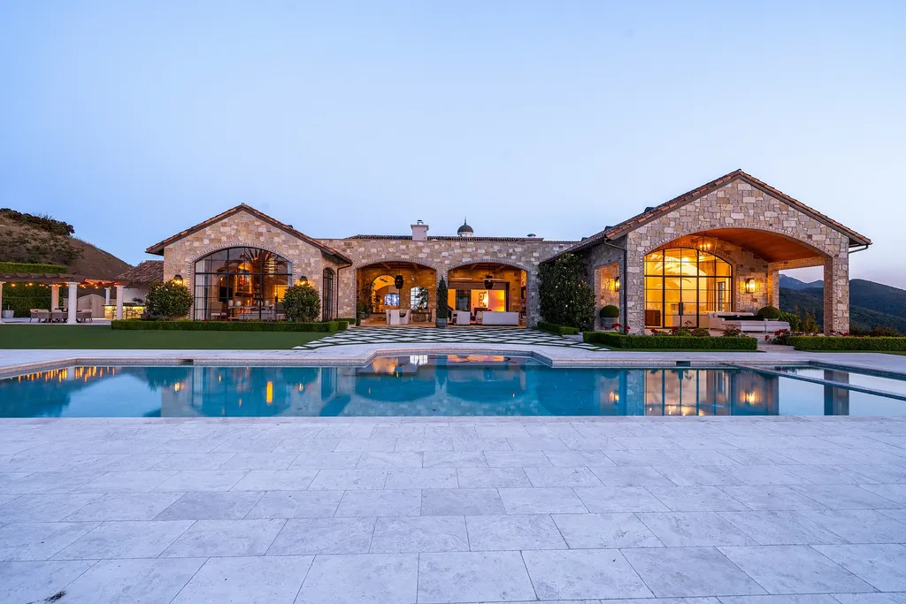 2700 White Stallion Road Home in Thousand Oaks, California. Discover the absolute crown jewel of Hidden Valley in the prestigious White Stallion Ranch gated community. This completely rebuilt Napa farmhouse sits on 22 private landscaped acres, offering breathtaking 360-degree views of city lights, mountains, and the ocean. 