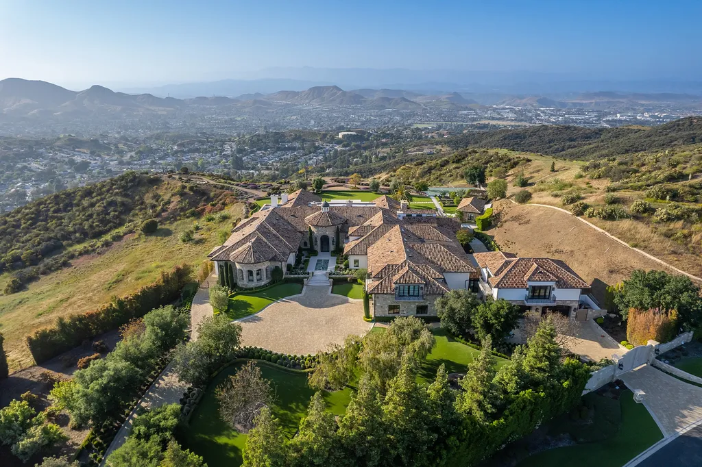 2700 White Stallion Road Home in Thousand Oaks, California. Discover the absolute crown jewel of Hidden Valley in the prestigious White Stallion Ranch gated community. This completely rebuilt Napa farmhouse sits on 22 private landscaped acres, offering breathtaking 360-degree views of city lights, mountains, and the ocean. 