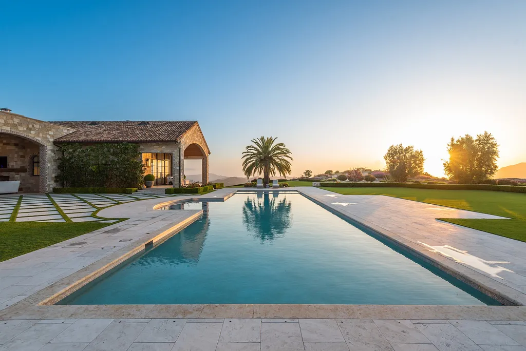2700 White Stallion Road Home in Thousand Oaks, California. Discover the absolute crown jewel of Hidden Valley in the prestigious White Stallion Ranch gated community. This completely rebuilt Napa farmhouse sits on 22 private landscaped acres, offering breathtaking 360-degree views of city lights, mountains, and the ocean. 