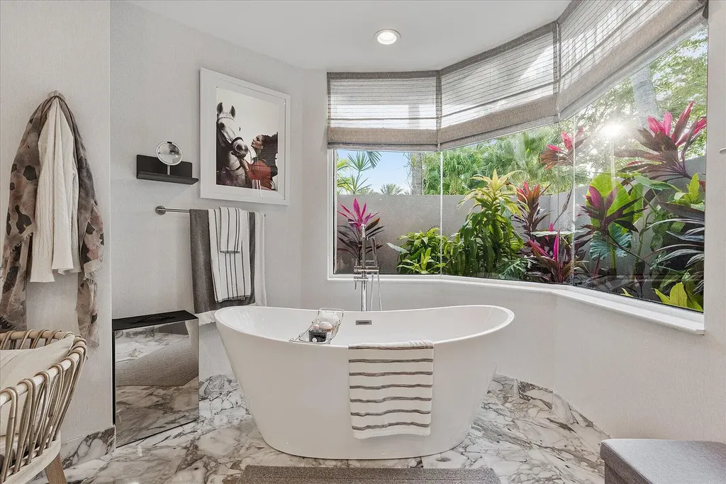 2770 Long Meadow Drive Home in Wellington, Florida. Recently renovated with high-end finishes, this home exudes elegance and sophistication. The interior is tastefully decorated, creating a warm and inviting atmosphere with meticulous attention to detail. There are plenty of different spaces to gather with family and friends, making it perfect for entertaining.