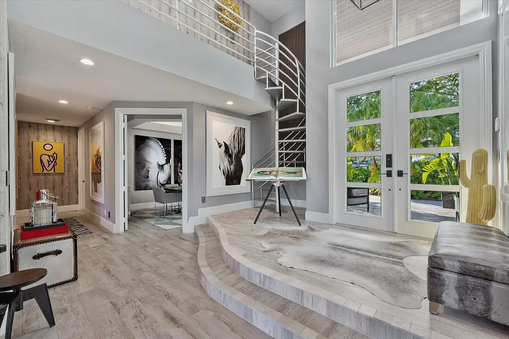2770 Long Meadow Drive Home in Wellington, Florida. Recently renovated with high-end finishes, this home exudes elegance and sophistication. The interior is tastefully decorated, creating a warm and inviting atmosphere with meticulous attention to detail. There are plenty of different spaces to gather with family and friends, making it perfect for entertaining.