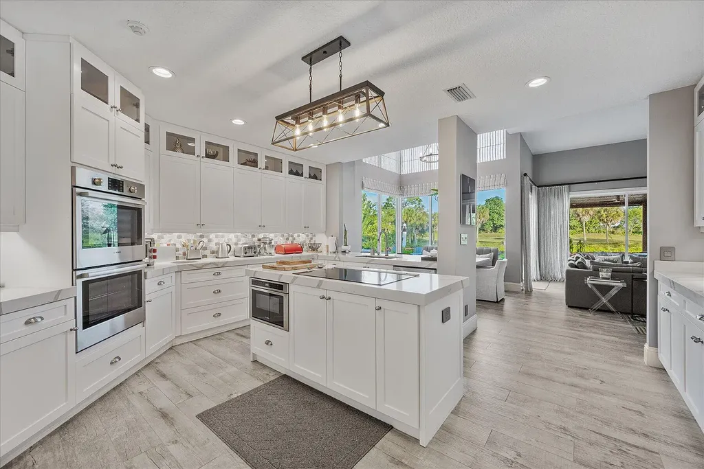 2770 Long Meadow Drive Home in Wellington, Florida. Recently renovated with high-end finishes, this home exudes elegance and sophistication. The interior is tastefully decorated, creating a warm and inviting atmosphere with meticulous attention to detail. There are plenty of different spaces to gather with family and friends, making it perfect for entertaining.