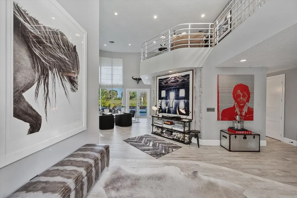 2770 Long Meadow Drive Home in Wellington, Florida. Recently renovated with high-end finishes, this home exudes elegance and sophistication. The interior is tastefully decorated, creating a warm and inviting atmosphere with meticulous attention to detail. There are plenty of different spaces to gather with family and friends, making it perfect for entertaining.