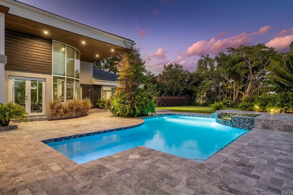 2770 Long Meadow Drive Home in Wellington, Florida. Recently renovated with high-end finishes, this home exudes elegance and sophistication. The interior is tastefully decorated, creating a warm and inviting atmosphere with meticulous attention to detail. There are plenty of different spaces to gather with family and friends, making it perfect for entertaining.