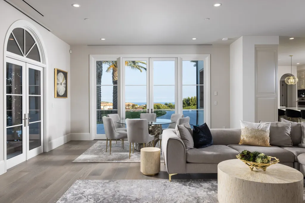 28 Tide Watch Home in Newport Beach, California. Discover the epitome of modern luxury in the prestigious Crystal Cove community. This sophisticated custom-built home boasts sweeping ocean and mountain views, six bedrooms, eight baths, and state-of-the-art technology. Impeccable craftsmanship and high-end finishes are complemented by spacious entertainment areas, indoor/outdoor living, and a stunning backyard with a pool, spa, and alfresco dining options.
