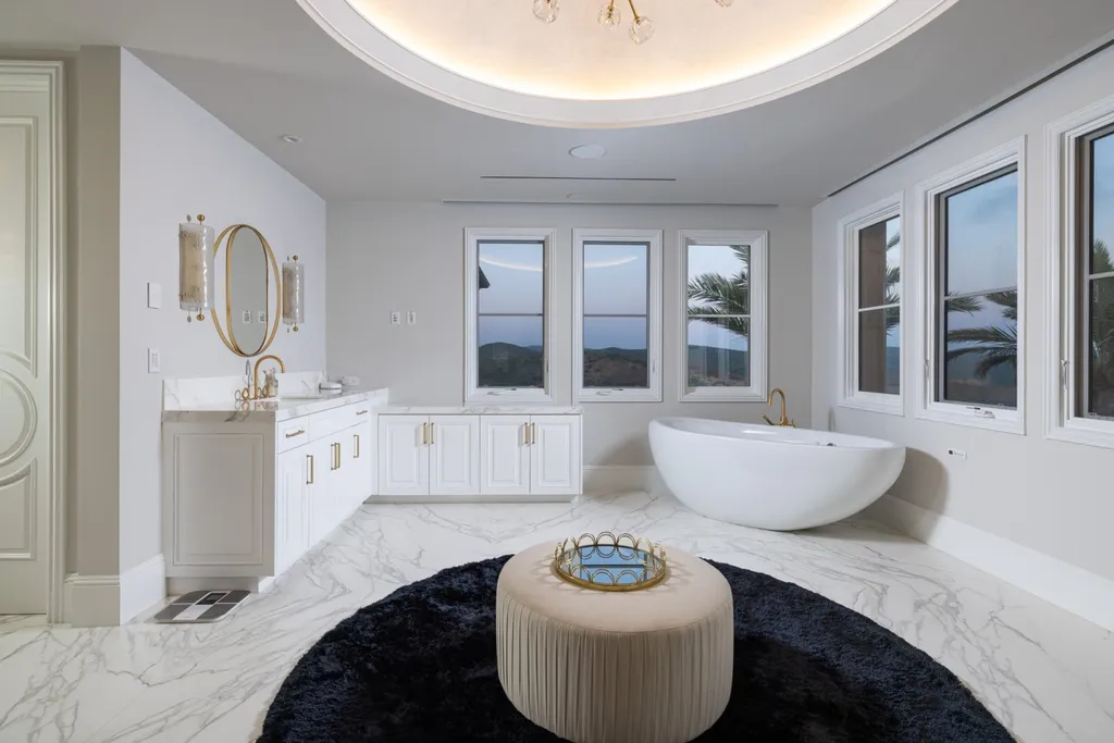 28 Tide Watch Home in Newport Beach, California. Discover the epitome of modern luxury in the prestigious Crystal Cove community. This sophisticated custom-built home boasts sweeping ocean and mountain views, six bedrooms, eight baths, and state-of-the-art technology. Impeccable craftsmanship and high-end finishes are complemented by spacious entertainment areas, indoor/outdoor living, and a stunning backyard with a pool, spa, and alfresco dining options.