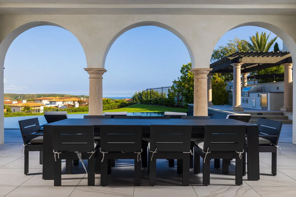 28 Tide Watch Home in Newport Beach, California. Discover the epitome of modern luxury in the prestigious Crystal Cove community. This sophisticated custom-built home boasts sweeping ocean and mountain views, six bedrooms, eight baths, and state-of-the-art technology. Impeccable craftsmanship and high-end finishes are complemented by spacious entertainment areas, indoor/outdoor living, and a stunning backyard with a pool, spa, and alfresco dining options.