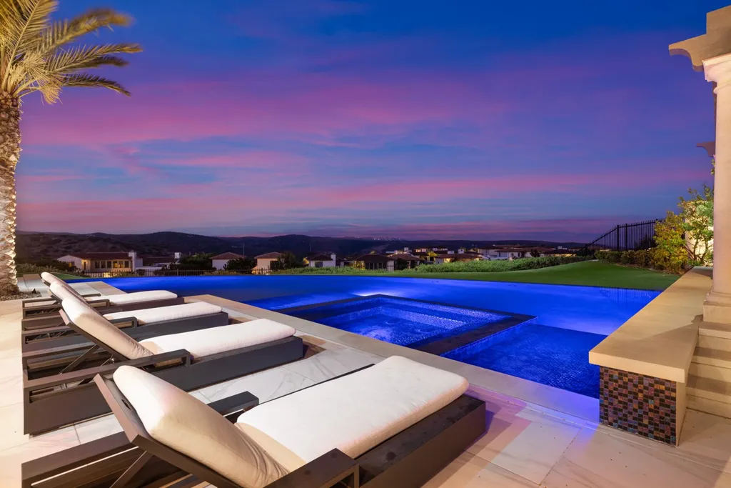 28 Tide Watch Home in Newport Beach, California. Discover the epitome of modern luxury in the prestigious Crystal Cove community. This sophisticated custom-built home boasts sweeping ocean and mountain views, six bedrooms, eight baths, and state-of-the-art technology. Impeccable craftsmanship and high-end finishes are complemented by spacious entertainment areas, indoor/outdoor living, and a stunning backyard with a pool, spa, and alfresco dining options.