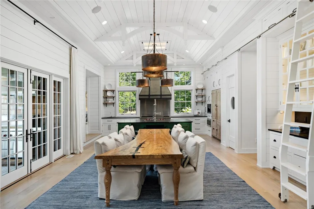 282 Timber Ridge Lane Home in Lake Ozark, Missouri. "Nantucket Point" is the ultimate Crown Jewel of Lake of The Ozarks, offering 1.24 acres of unparalleled beauty with 500' of shoreline, deep water, and breathtaking views. This Nantucket-inspired 6,800 sqft estate exudes laid-back luxury and coastal design, featuring 6 ensuite bedrooms, 2 gourmet kitchens, a gym, game room, and more. 