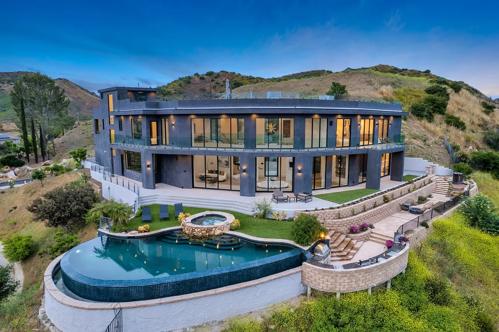 28888 Lake Vista Drive Home in Agoura Hills, California. Welcome to the exclusive ''Lake Vista Estate'' in Malibou Lake, offering a one-of-a-kind trophy masterpiece with breathtaking jet liner views unmatched in Southern California. This brand new European Contemporary home, designed by GoDesign21, features over 6500 square feet of luxurious living space on 3.41 acres of complete privacy in the Santa Monica mountains. 