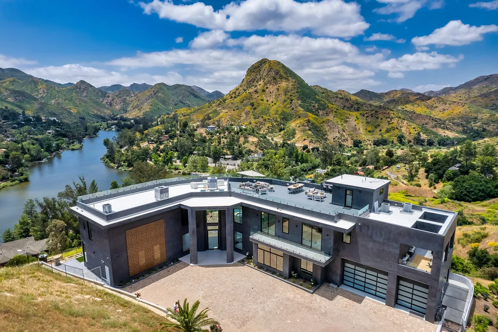28888 Lake Vista Drive Home in Agoura Hills, California. Welcome to the exclusive ''Lake Vista Estate'' in Malibou Lake, offering a one-of-a-kind trophy masterpiece with breathtaking jet liner views unmatched in Southern California. This brand new European Contemporary home, designed by GoDesign21, features over 6500 square feet of luxurious living space on 3.41 acres of complete privacy in the Santa Monica mountains. 