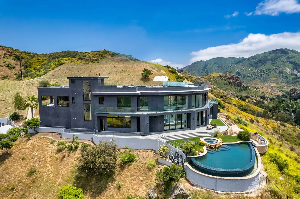 28888 Lake Vista Drive Home in Agoura Hills, California. Welcome to the exclusive ''Lake Vista Estate'' in Malibou Lake, offering a one-of-a-kind trophy masterpiece with breathtaking jet liner views unmatched in Southern California. This brand new European Contemporary home, designed by GoDesign21, features over 6500 square feet of luxurious living space on 3.41 acres of complete privacy in the Santa Monica mountains. 