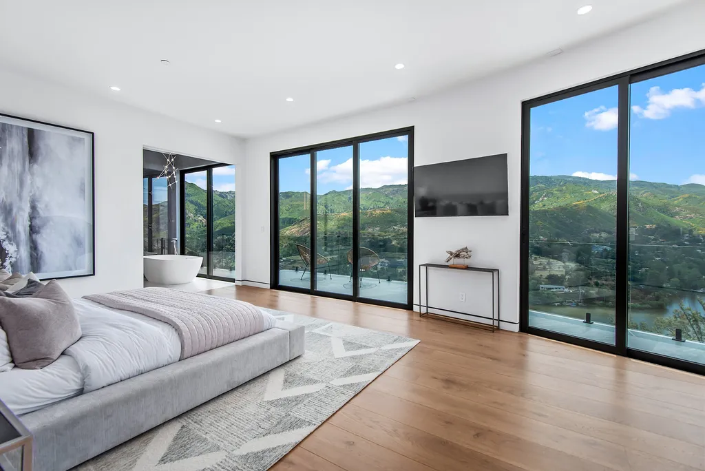 28888 Lake Vista Drive Home in Agoura Hills, California. Welcome to the exclusive ''Lake Vista Estate'' in Malibou Lake, offering a one-of-a-kind trophy masterpiece with breathtaking jet liner views unmatched in Southern California. This brand new European Contemporary home, designed by GoDesign21, features over 6500 square feet of luxurious living space on 3.41 acres of complete privacy in the Santa Monica mountains. 