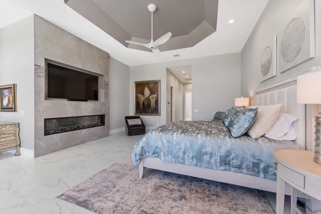 3057 SE Dune Drive Home in Stuart, Florida. Discover this artfully reimagined and fully renovated home boasting panoramic views of a Jack Nicklaus golf course, the lake, and the ocean. Flooded with natural light through 166 windows, the neutral palette accentuates exquisite finishes and architectural details. 